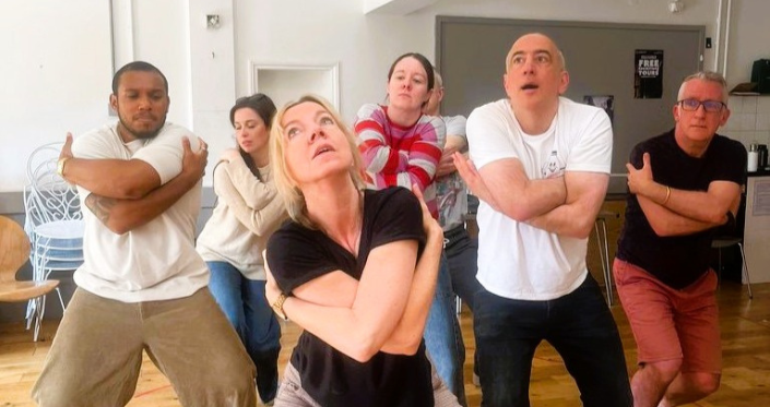 Performers in various physical poses